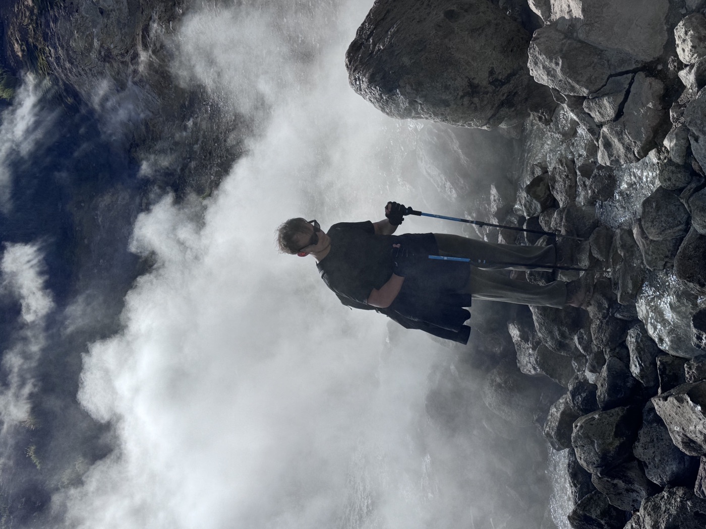Dmitrii hiking among rocks and steam in Kamchatka